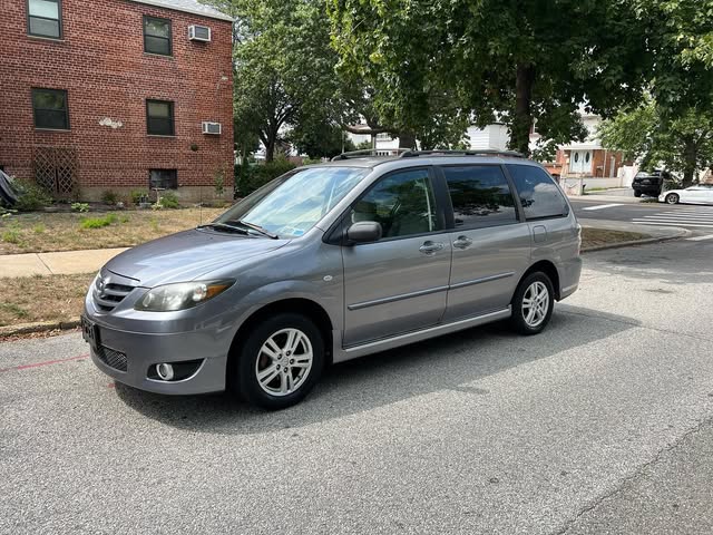 Grey minivan previously purchased by We Buy Cars NY